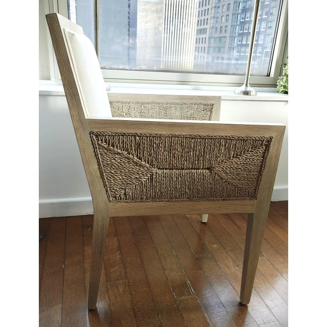 Jeffrey Alan Marks Collection. Hardwood frame and legs with hand-woven lampakanai rope on the outside back and arms. Chair...