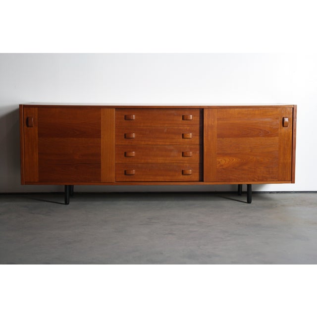 About the Danish Modern Domino Mobler Teak Credenza - Low Profile Cabinet This Danish Modern Credenza by Domino Mobler...