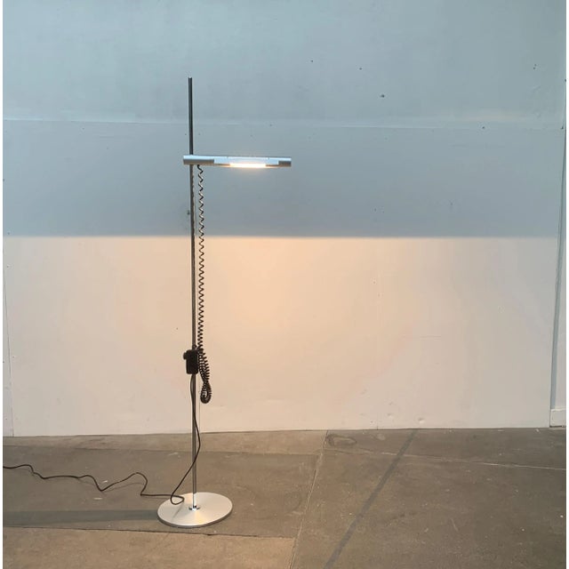 Halo floor lamp by Swiss Lamps according to a design of Rosemarie and Rico Baltensweiler from 1970. A timeless and...