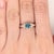 A rare blue diamond sits with a rare fancy blue at the centre of this solid 14K yellow gold ring. A fancy blue is among...