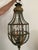 Beautiful vintage foliate lantern with leaf details and an acorn finial in an aged, patinated brass finish. Areas of...