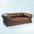 Vintage 1970s leather patchwork sofa/ double bed with a bold, sculptural design. This two-seat piece, showcasing unique...
