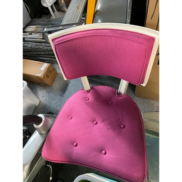 Mid-century chair with pink woven fabric. Could be used for desk or an occasional chair.