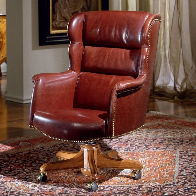 Elegant presidential armchair with leather coating. The production of each original article of the Marzorati collections...