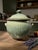 Hand-thrown stoneware lidded pot in a soft celadon/green drip glaze made by Brad Tucker, from the Cedar Creek Pottery in...