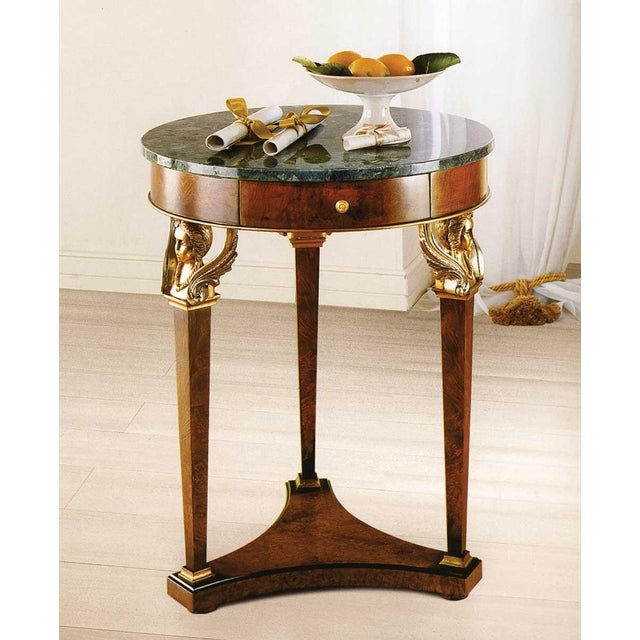 Handcrafted in Italy from olive ash burl, this small accent table features a Green Alpi marble top and a single drawer....