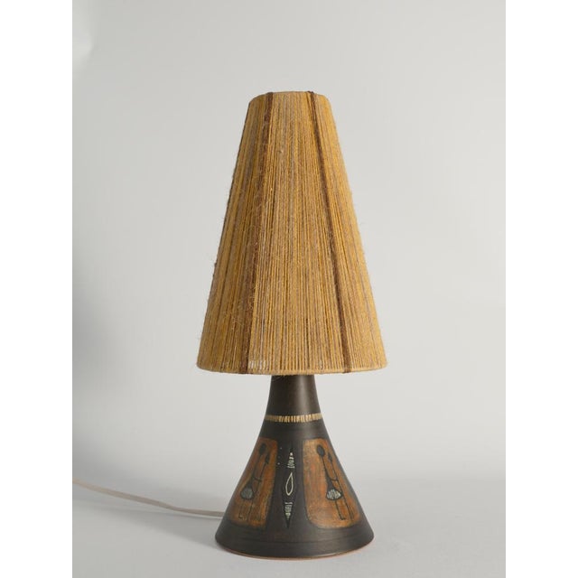 This handmade stoneware table lamp was crafted by Munk Keramik in Enköping, Sweden, a studio active from 1952 to 2005. It...