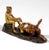 A faun lying on his back, his right leg raised onto his left knee; near his head, a female nude with her hair pinned up...