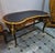 This elegant French Louis XV style writing desk showcases a sophisticated kidney-shaped silhouette, luxurious black...