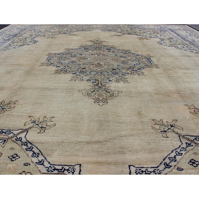 Antique Turkish Oushak with Geometric Motifs in Champagne Field and Accent Blue, Oushak antique rug from Turkey. Keivan...