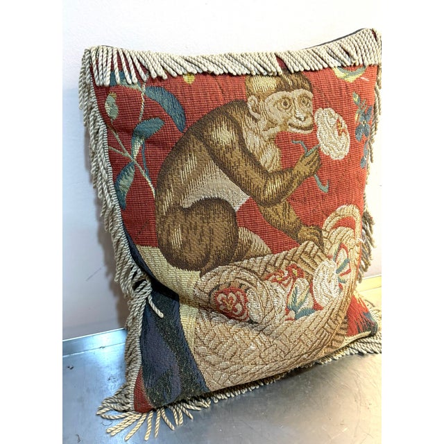 1980s-90s red/tan needlepoint monkey pillow w/ bullion fringe and blue velvet backing. Excellent condition. Measures 16" x...
