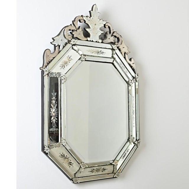 A dazzling Venetian-style octagonal mirror from the 19th century that projects from the wall like cushion mirrors of the...