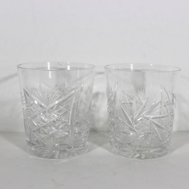 Pair of cut crystal rocks glasses. These have a cut pineapple pattern on one side and a cut starburst pattern on the other...
