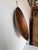 Vintage hand-carved wooden bowl featuring a beautiful primitive organic form and rich aged patina. This large shallow bowl...