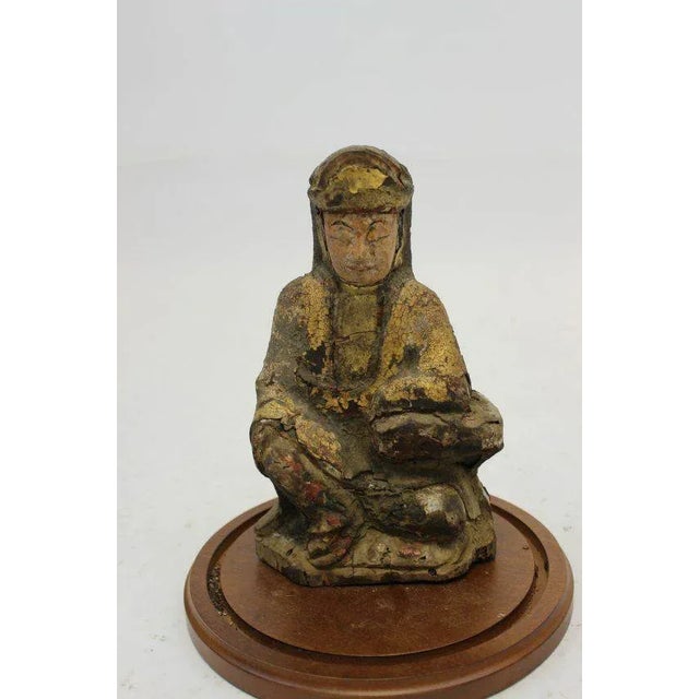 For your consideration is a Rare Vintage Buddha like wooden sculpture with remnants of black red and gold polychrome still...