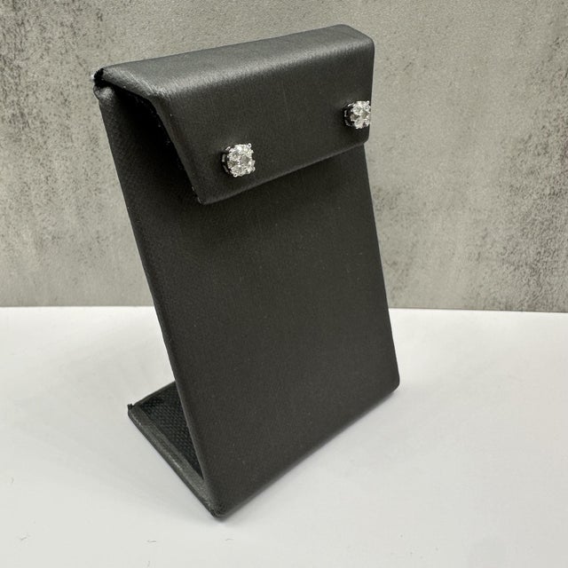 These elegant diamond cluster earrings in 10kt white gold feature 0.50 carats total weight of natural IJ, I quality round...