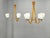 A rare pair of mid-century modern chandeliers manufactured by dřevo humpolec in czechoslovakia during the 1970s. The set...