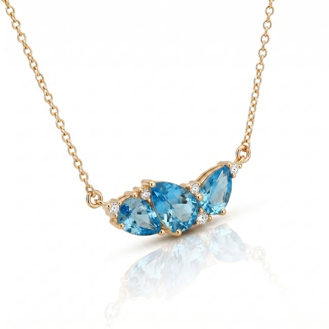 Capture the radiance of clear tropical waters with this eye-catching Swiss Blue Topaz pendant. Three faceted pear-shaped...