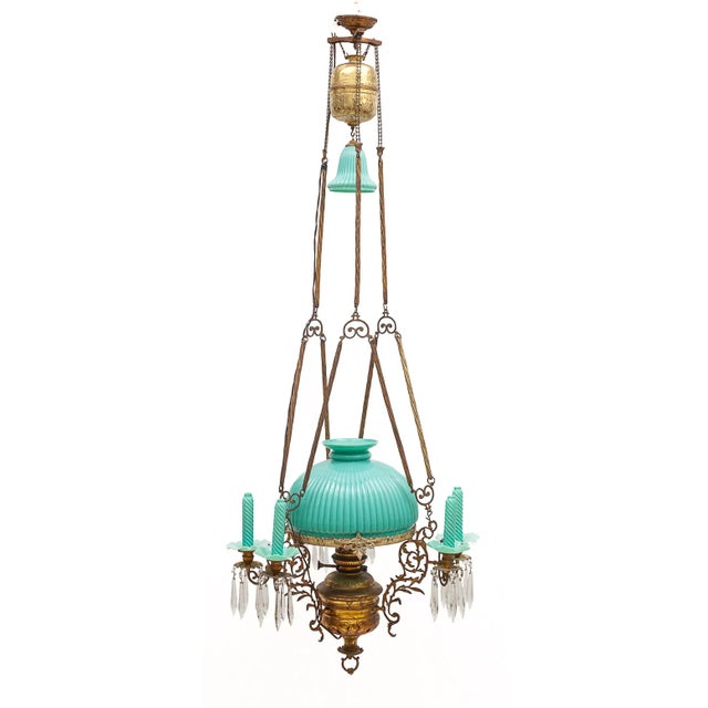 Belgian brass pendant light. Turquoise opaline. Fake candles and opaline bobeches. Tassels. 1 central light. Up-down...
