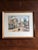 Set of three framed color prints by French artist Elis’ee Maclet. Number 1, Rue de l'Abreuvoir. It depicts a famous,...