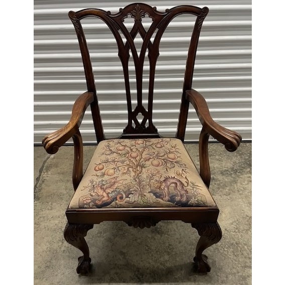 This elegant antique chair dates from the 1880s and is crafted from solid mahogany in Chippendale style, with a...