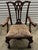 This elegant antique chair dates from the 1880s and is crafted from solid mahogany in Chippendale style, with a...
