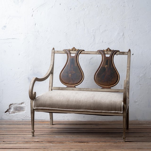 Continental Neoclassical carved, painted, and parcel‑gilt settee with vasiform backs painted with Orientalist oil scenes,...