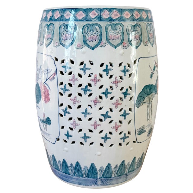 A vibrant green and pink Chinese porcelain garden stool featuring beautiful lotus flowers, dragonflies, cranes, and lucky...