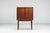 A rare bar cabinet designed by Illum Wikkelsø and produced by C.F. Christensen in Denmark during the 1960s. Crafted in...