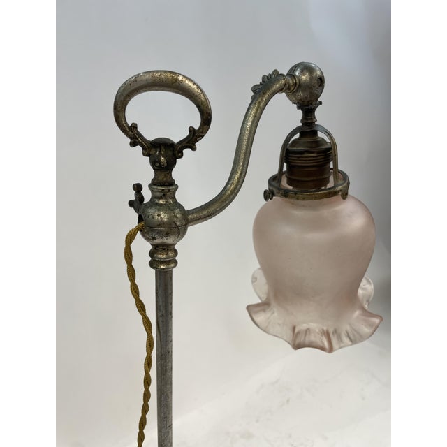 Beautiful French Abat-Jour from the 1920s. Made of worked metal, with antique pink glass lampshade and fabric power cord....