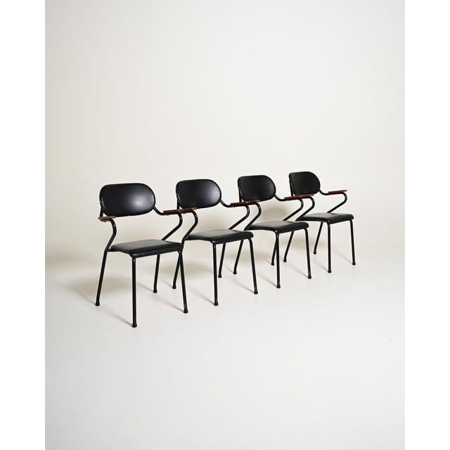 Black lacquered metal frame with black leather accents and natural teak details. Set of 4. Scandinavian design, 1950s. Set...