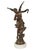 A finely cast patinated bronze sculpture depicting a graceful winged female figure in flowing drapery, poised in motion,...