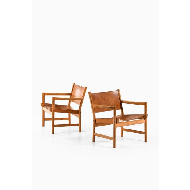 Rare pair of easy chairs / safari chairs in oak and leather, 1960's additional information: material: oak and leather...