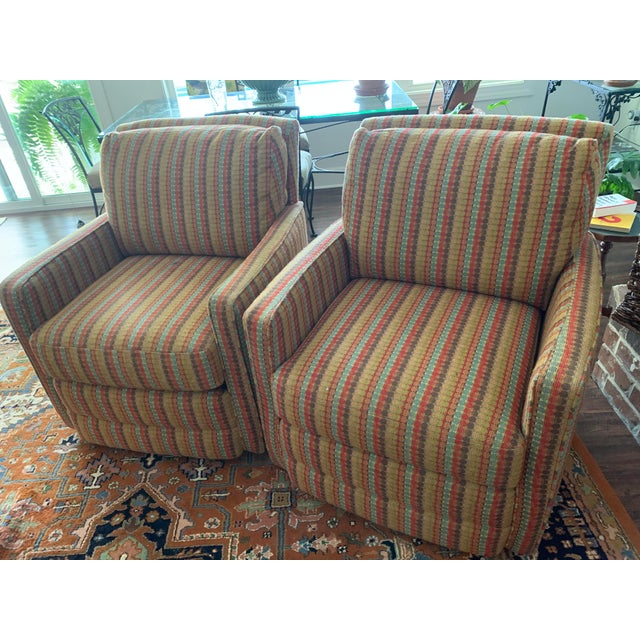 A pair of like new Basset wood frame,hand tied, swivels, in a multi-color pattern with an attached back cushion &...