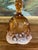 This vintage art glass bell features a rich amber-colored upper body over a white cased glass base, creating a warm, two-...