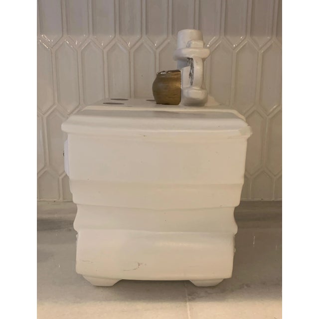Charming Vintage cookie jar shaped like vintage stove. In original white finish with gold accents. Center top comes off to...