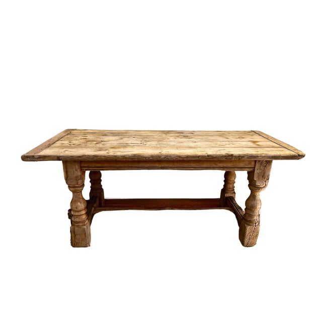 A French Farmhouse Table with turned legs, crafted from weathered oak for a rustic yet elegant look. Spacious and sturdy,...