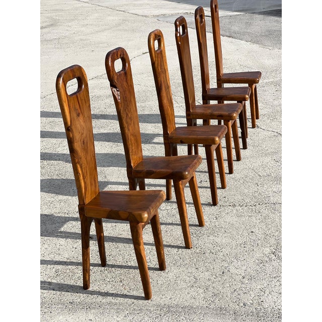 Exceptional set of six sculptural chairs in solid olive wood with high backs, crafted by a French cabinetmaker from Maison...