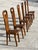 Exceptional set of six sculptural chairs in solid olive wood with high backs, crafted by a French cabinetmaker from Maison...