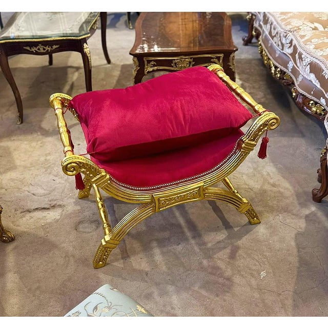 Stunning lovely red bench/settee. This is tufted in high end designer red velvet fabric. The frame has gold details. It...