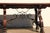 Impressive Spanish Baroque Revival trestle dining table, circa 1970s, crafted from a combination of rosewood and walnut...