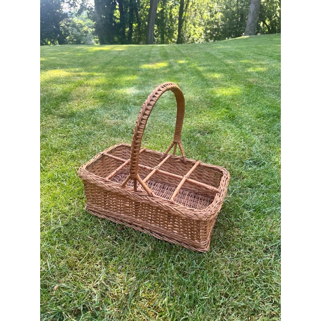 Listing is for a vintage willow basket wine carrier. The basket has a sturdy handle and 8 compartments that are...