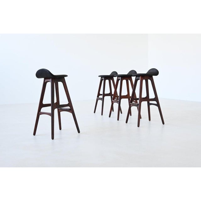 his set of four iconic model OD61 bar stools was designed by Erik Buch for Oddense Møbler, Denmark, 1965. A hallmark of...