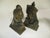 Vintage 1940's pair of emperor and emperies Asian style bookends. They have an antique brass finish and sculpted details....