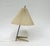 A delicate table lamp, made in Austria in the 1950s, is attributed to Kalmar. The lampshade provides a pleasant, glare-...