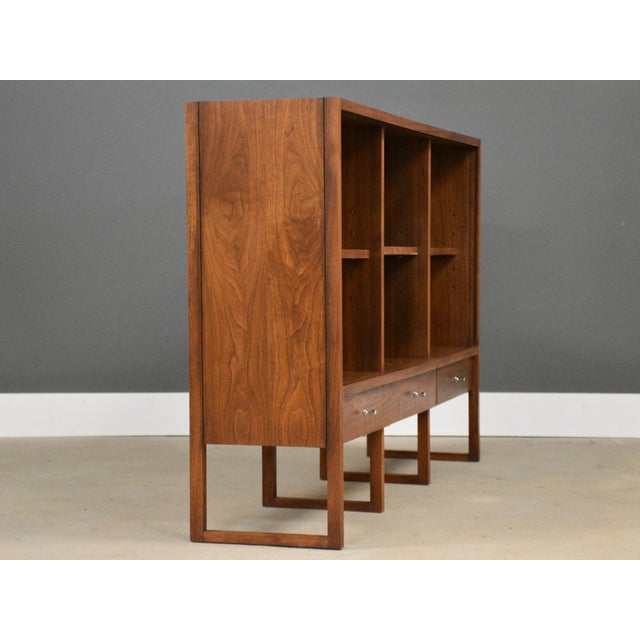 A mid century modern walnut bookcase with adjustable shelves designed by Paul McCobb for Lane’s Delineator collection....
