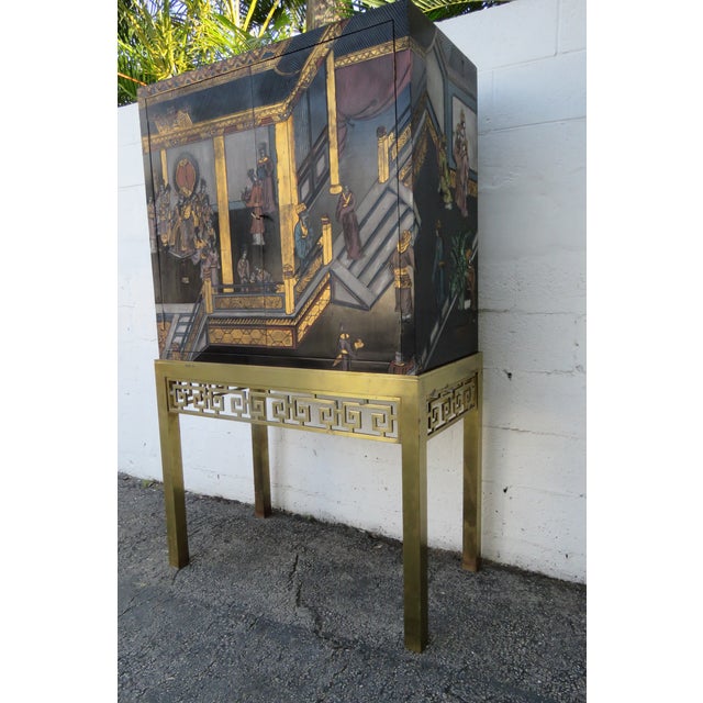 This brilliant China Cabinet is made of wood, and brass. The two part Cabinet was made by Maitland Smith a fine furniture...