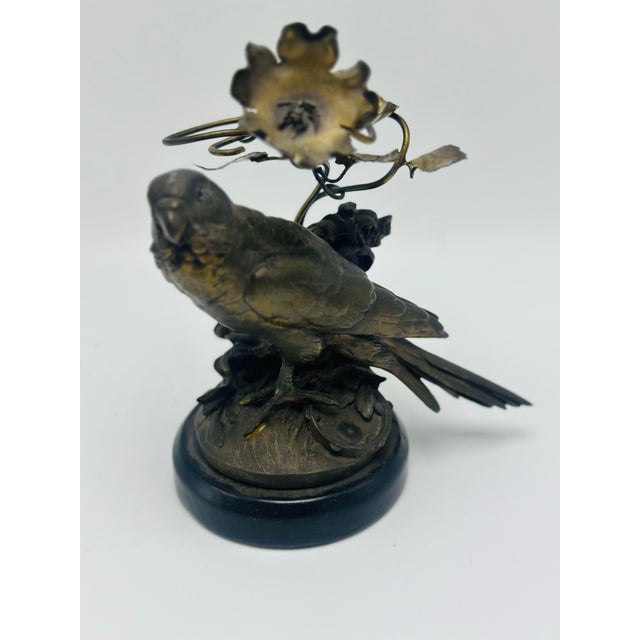 Charming vintage figural sculpture featuring a beautifully detailed parakeet perched among foliage and blossoms, finished...