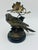 Charming vintage figural sculpture featuring a beautifully detailed parakeet perched among foliage and blossoms, finished...