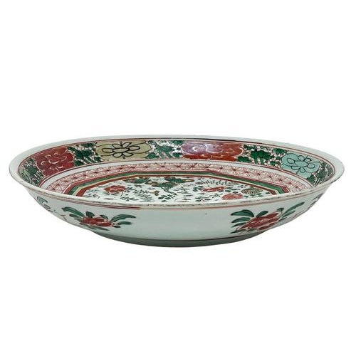 A large Wucai dish, 1700-1720 A richly colored in paint and enamel large dish from the Kangxi period 1700-1720, China. The...